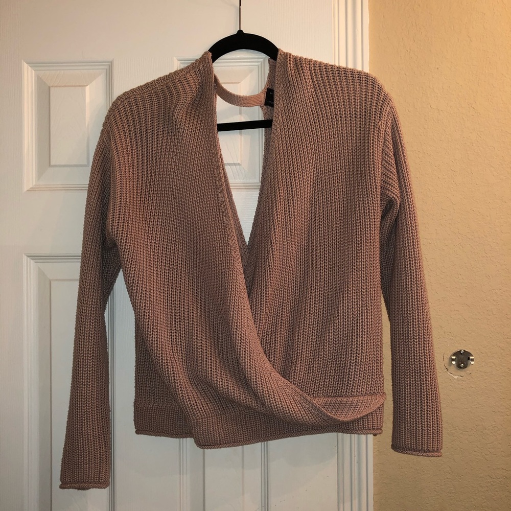 woman’s blush pink sweater